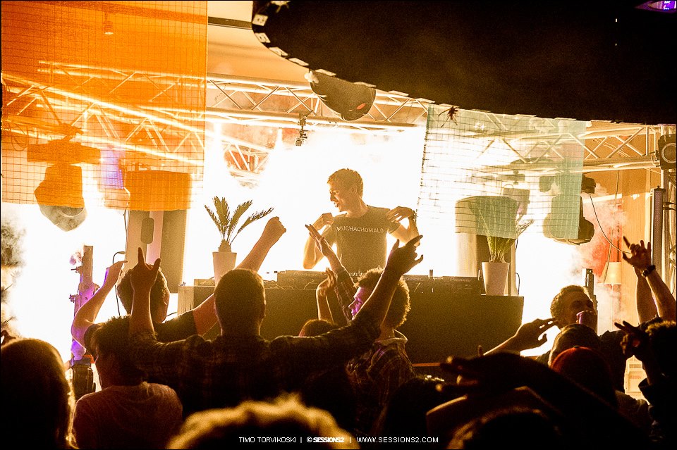 DJ on stage at a Muchachomalo club event