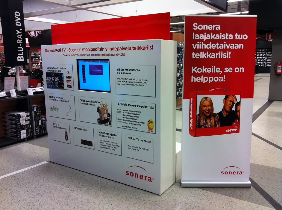 Sonera Koti TV stand with roll-up banners at an electronics store