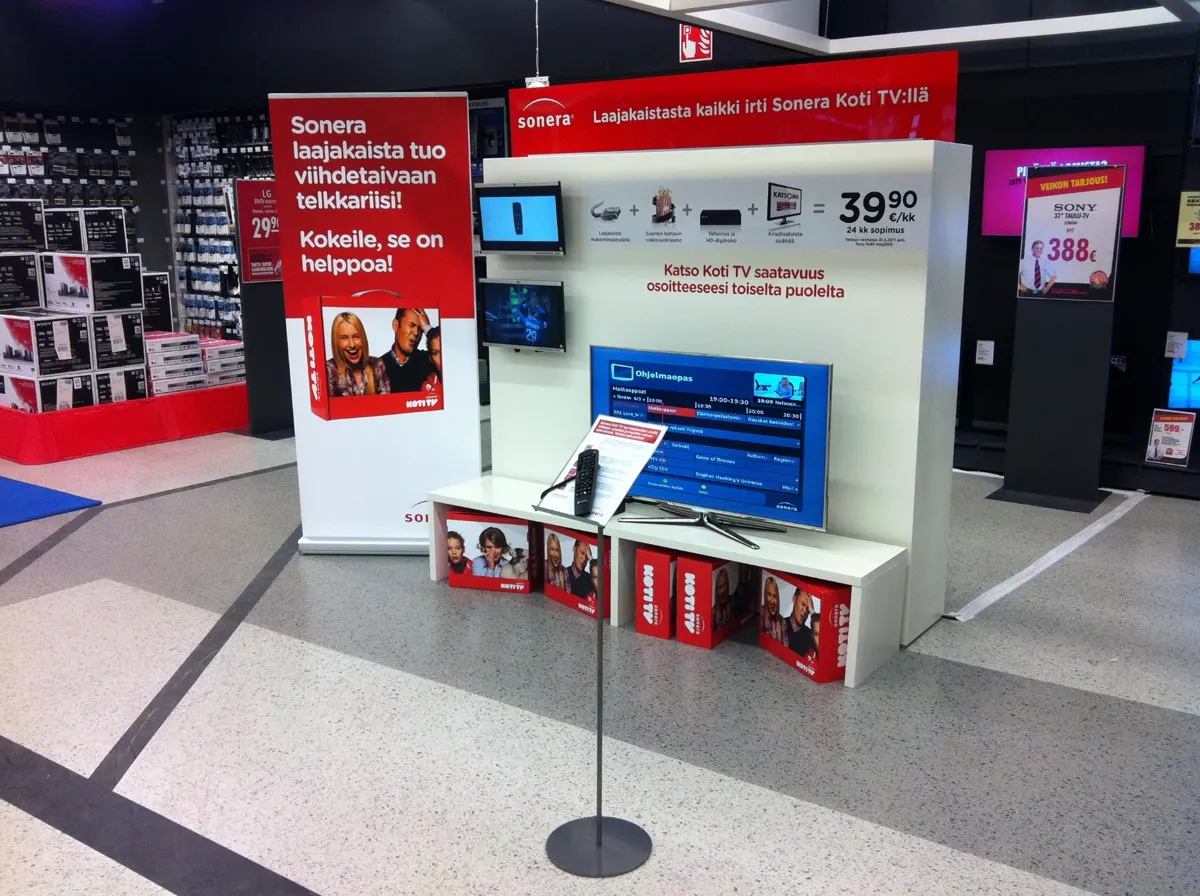 Sonera Koti TV demo stand with program guide at an electronics store